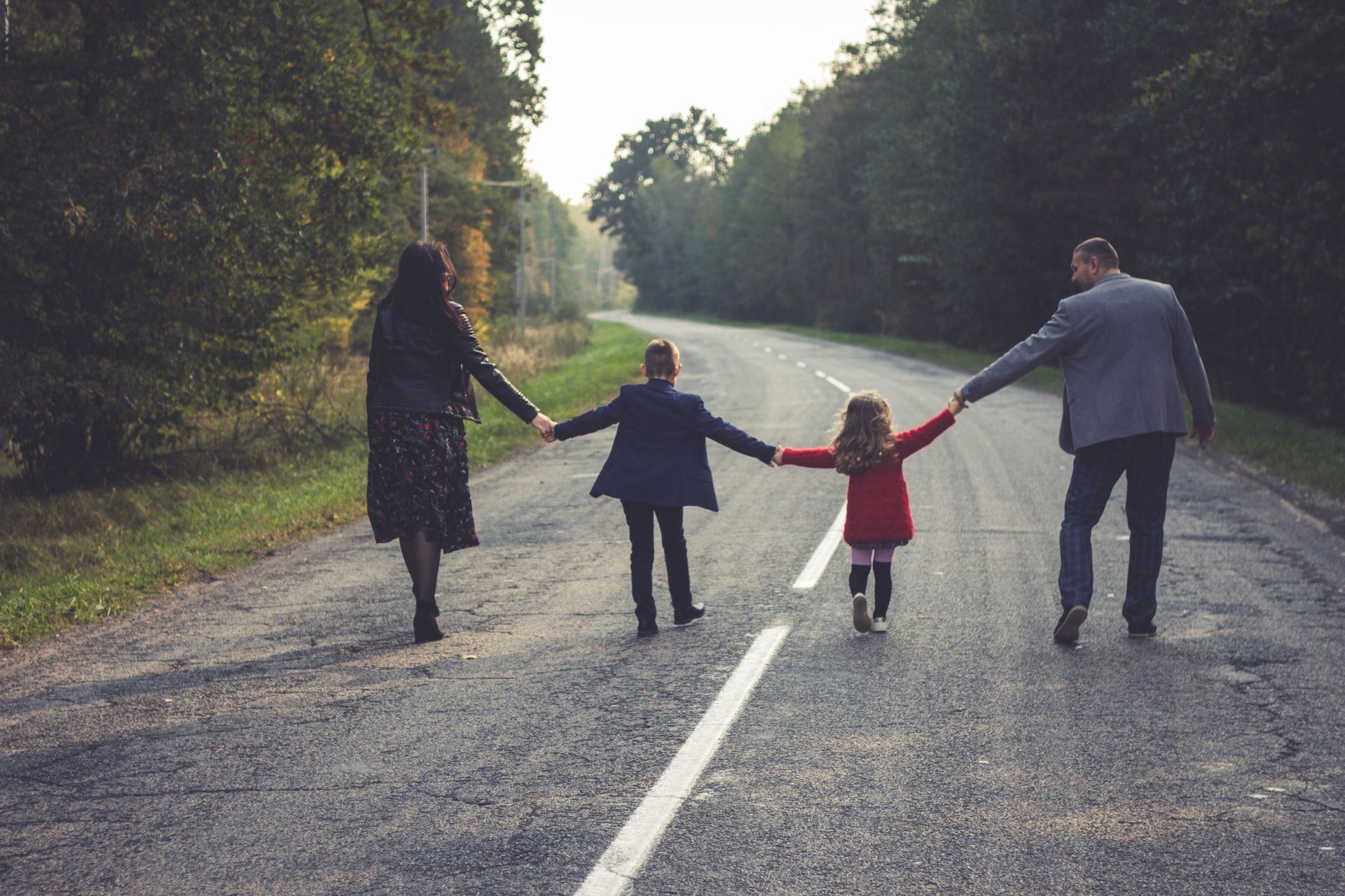 A family walking together along a road