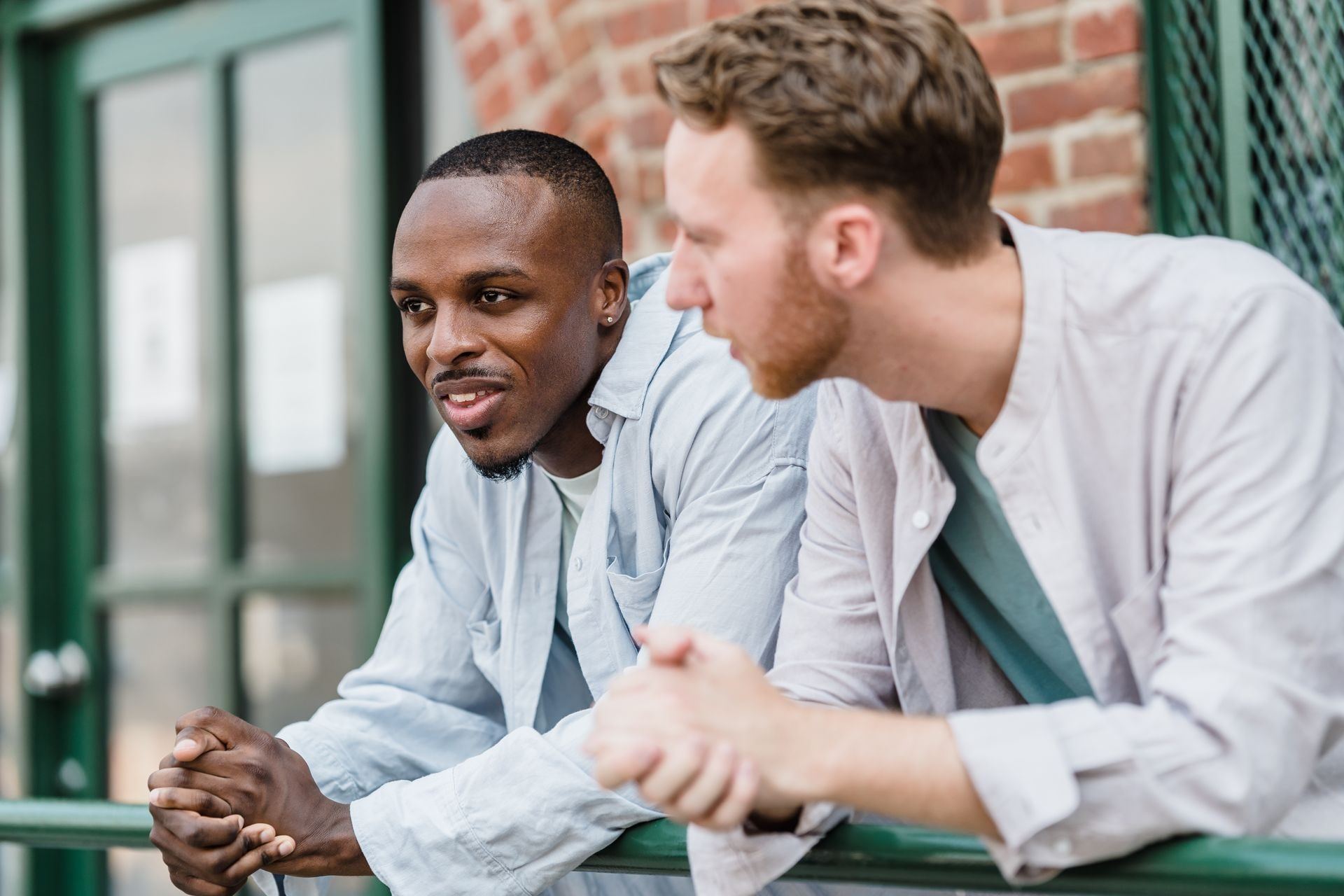 Two men talking together outdoors