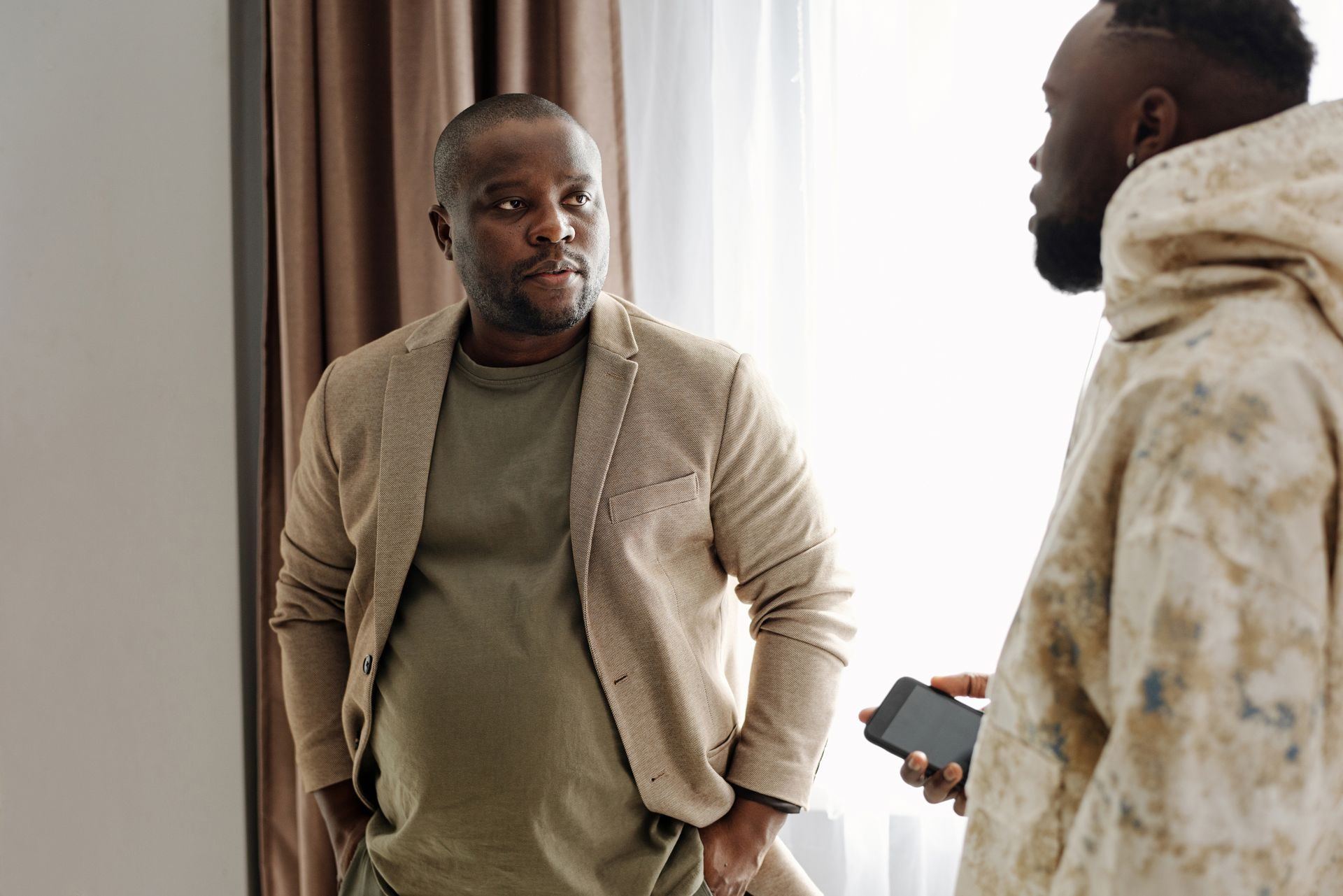 Two men talking together