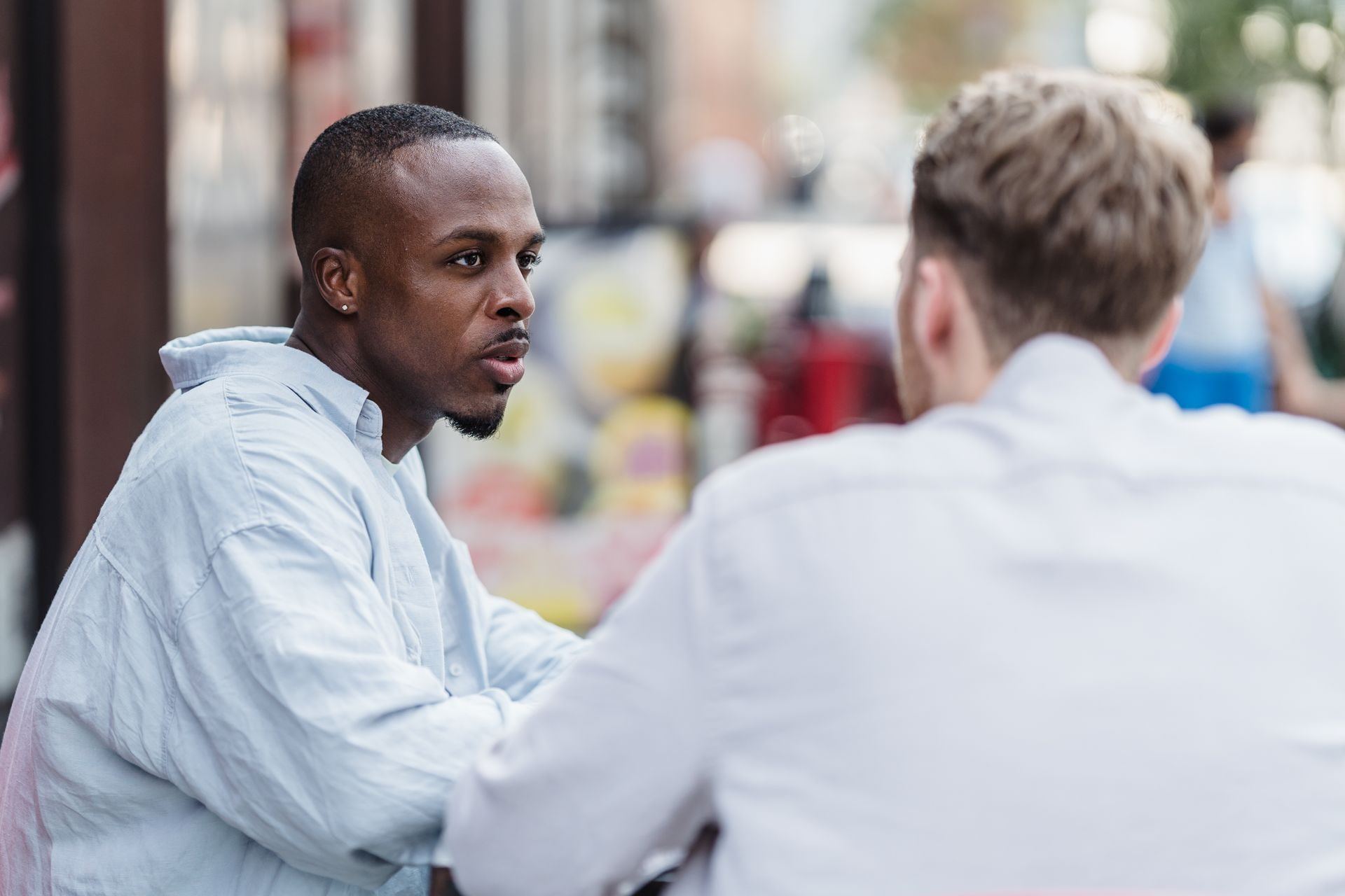 Two men sitting together in conversation
